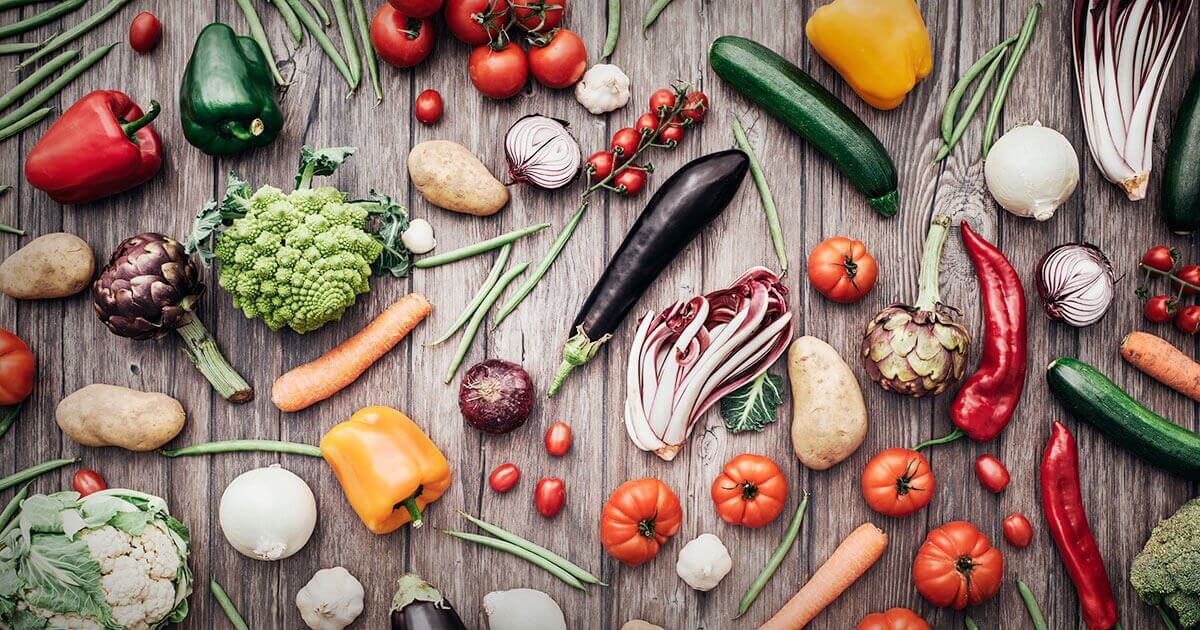 Assortment of vegetables on wooden table